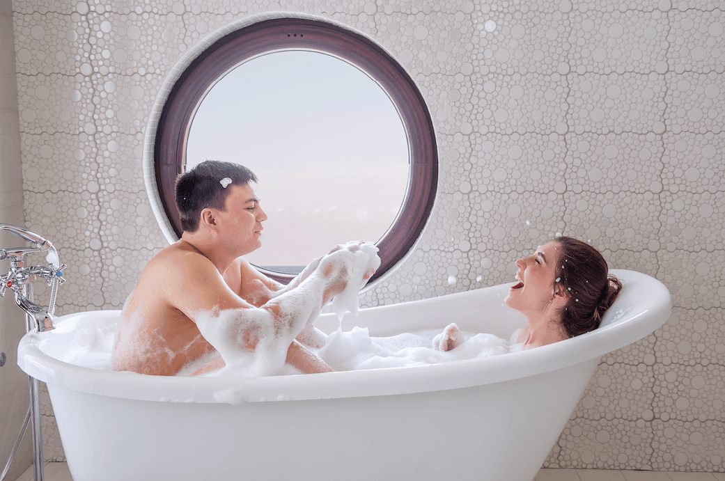 Couple enjoying a warm bubble bath together