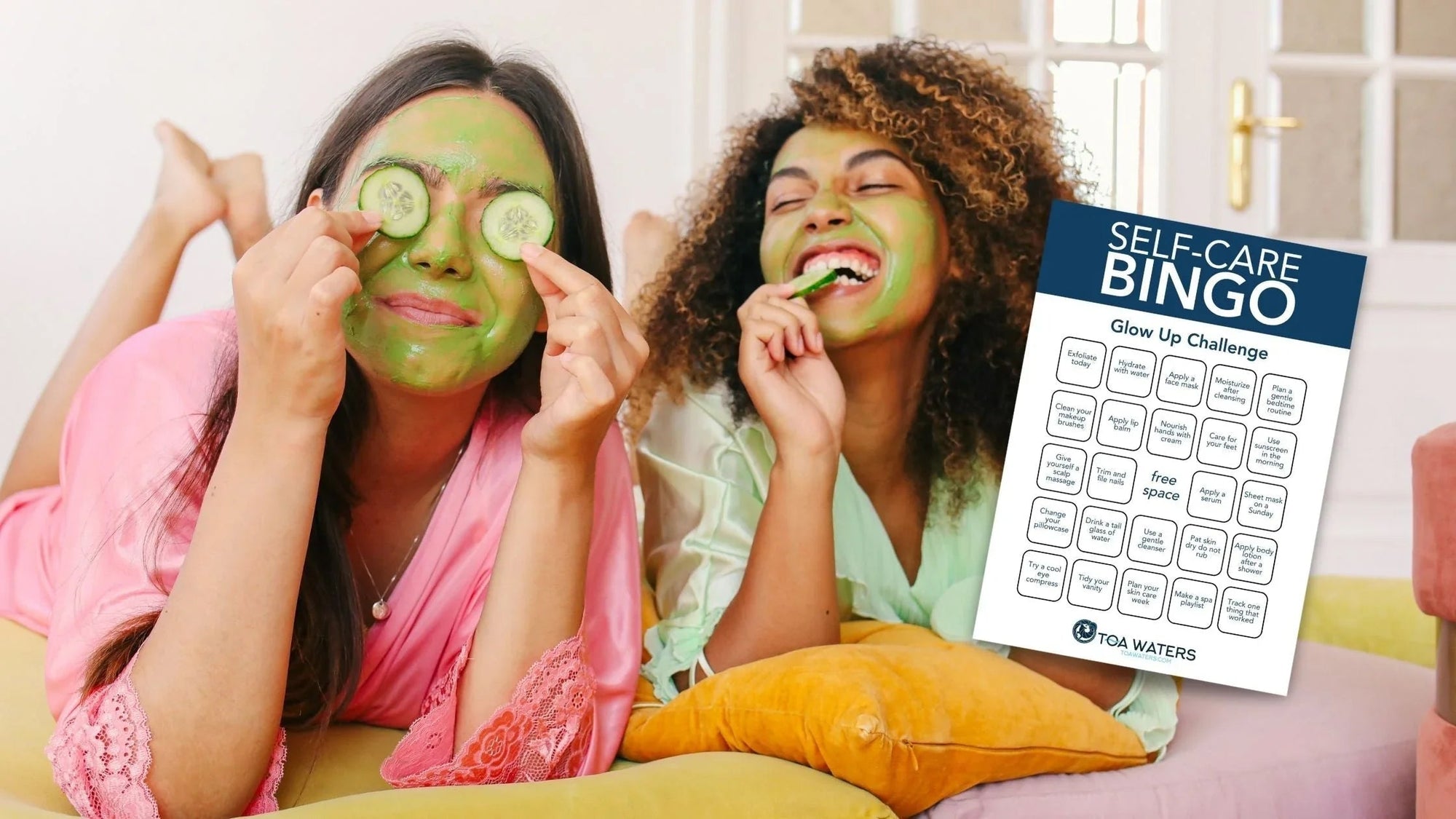 Two women with green face masks having fun with cucumber slices during self-care bingo challenge