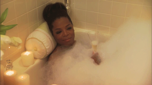 Oprah Winfrey taking a bubble bath